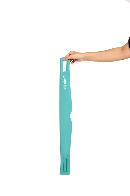 A hand holds the Mintzzz Chill Mask | Cooling Sleep Mask—long, turquoise, and padded—vertically against a white background.